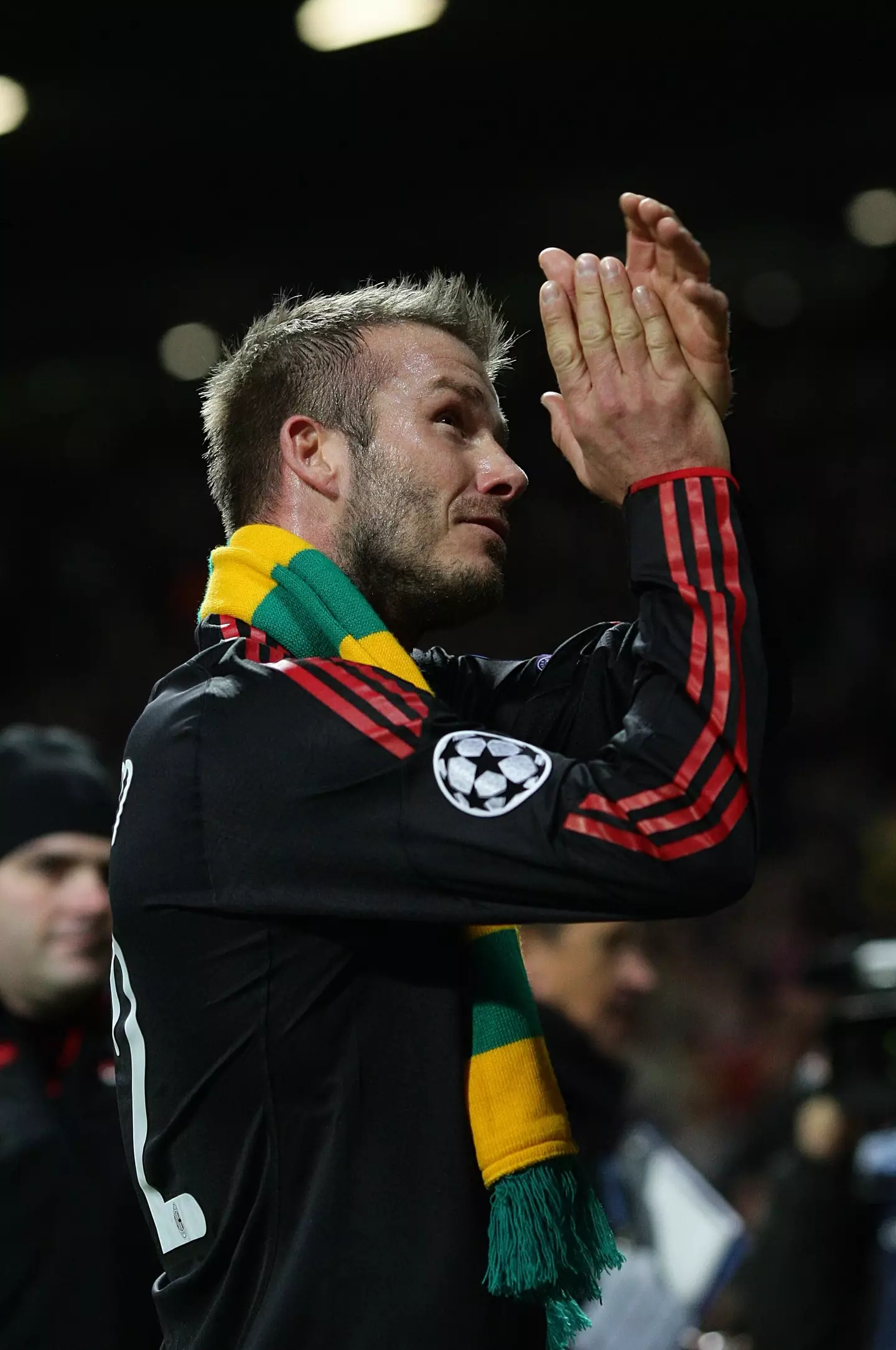 David Beckham wearing a scarf containing the famous 'Green and Gold' colours of the anti-Glazer movement while playing for AC Milan. (Alamy)