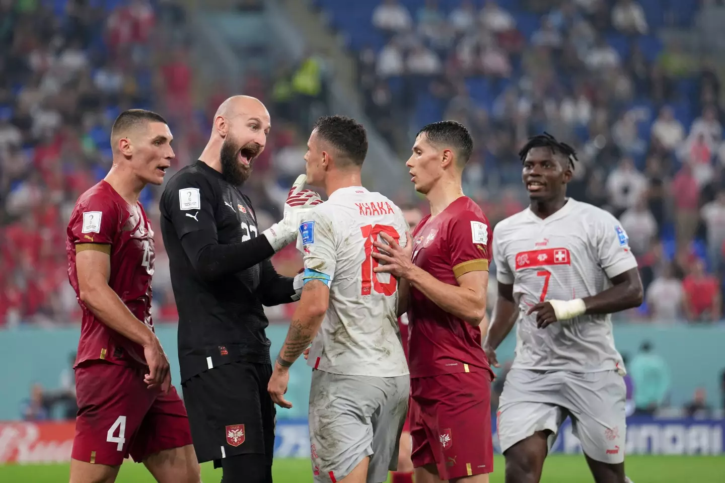 Xhaka is confronted by Serbia players. (Image