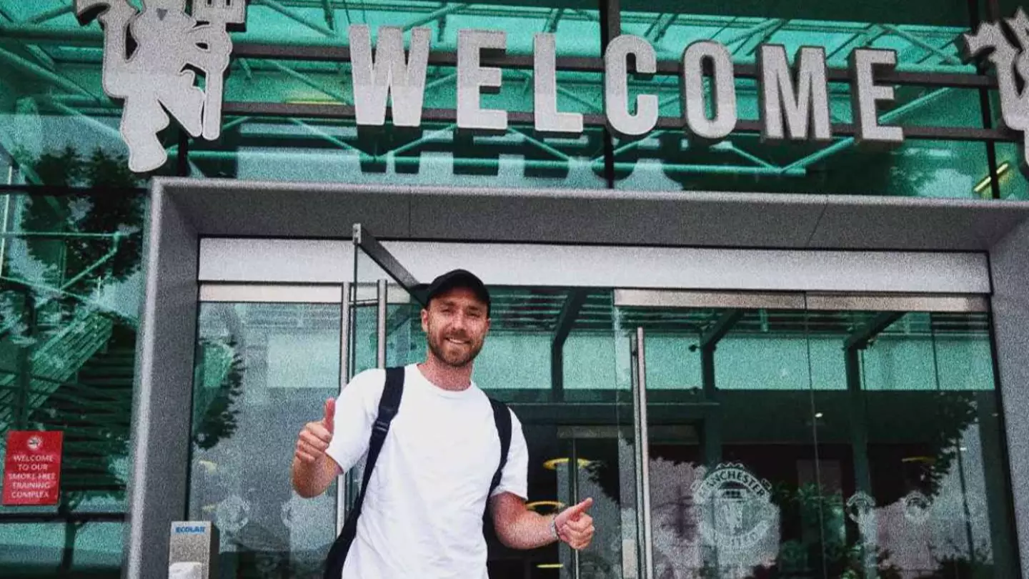 Christian Eriksen posing outside the entrance of the Carrington training centre. (Man Utd)