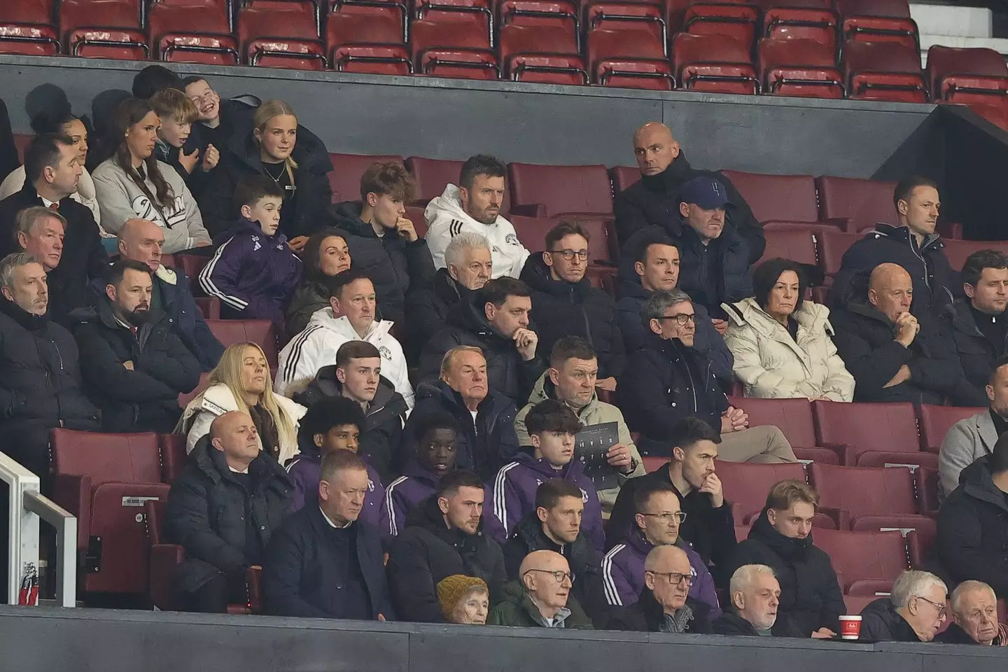 Rooney pictured sitting next to Carrick and Evans. Image credit: Getty