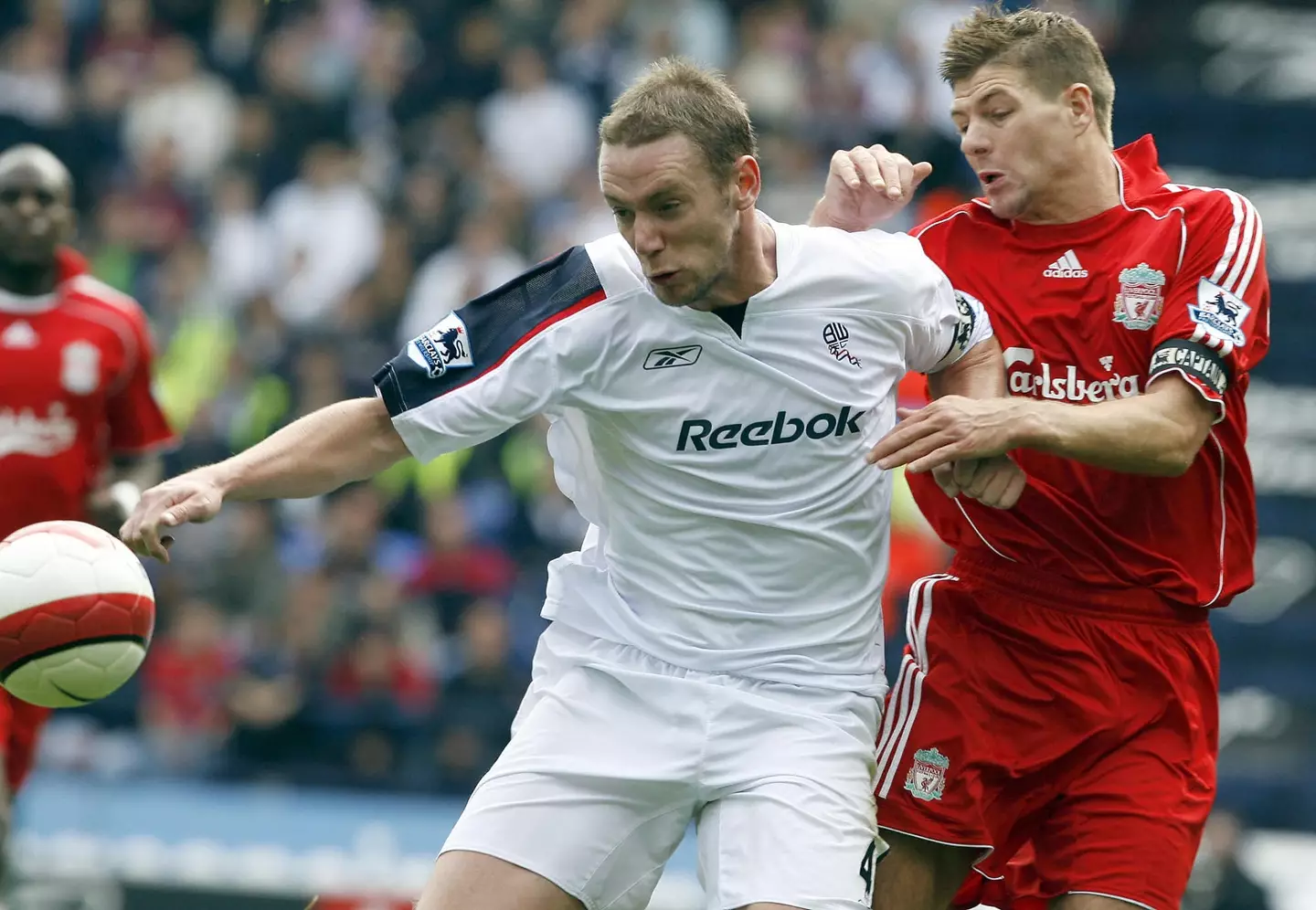 Kevin Nolan and Steven Gerrard duel for the ball. Image: Getty