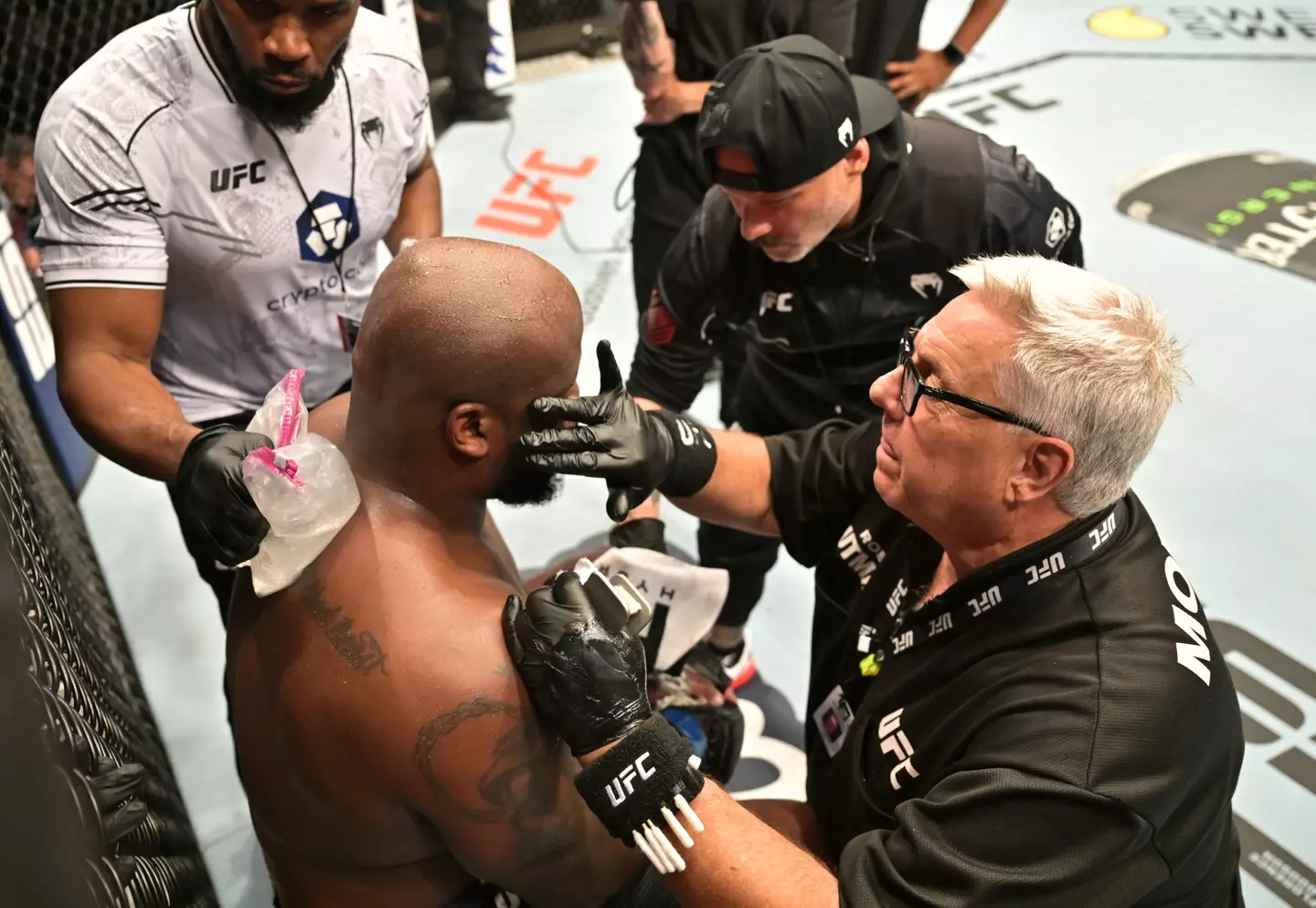 Cutman applies vaseline on Derrick Lewis' face during his fight against Jailton Almeida. Image: Getty