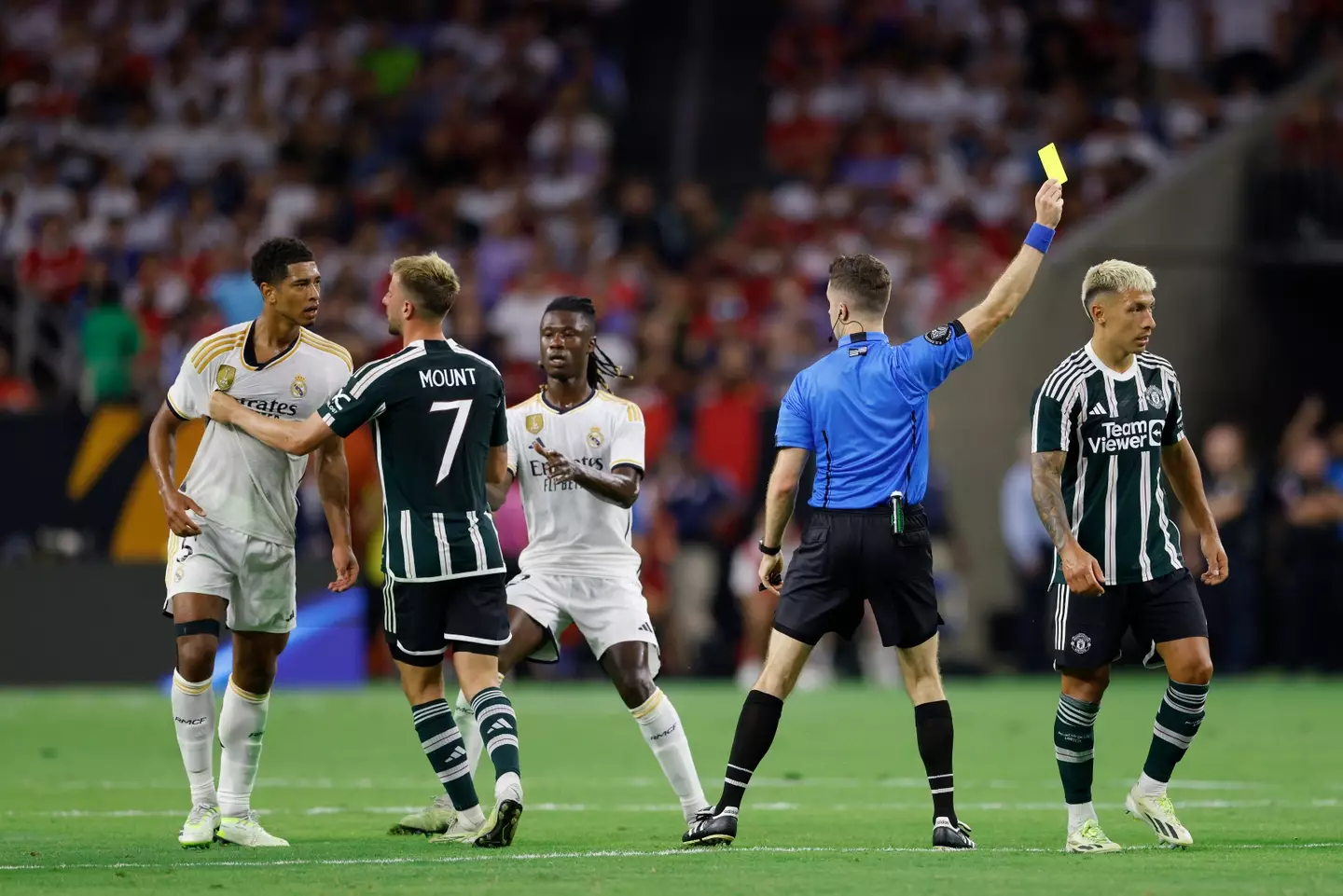 Jude Bellingham clashes with Lisandro Martinez. Image: Getty