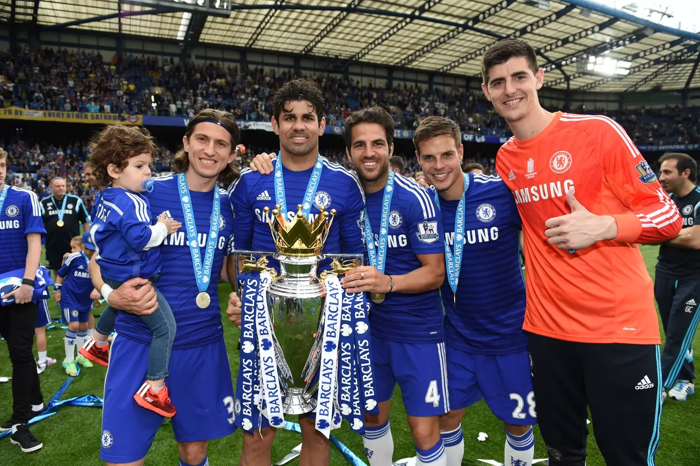 Cesc Fabregas and Thibaut Courtois, among others, celebrate winning the Premier League title with Chelsea. Image: Getty