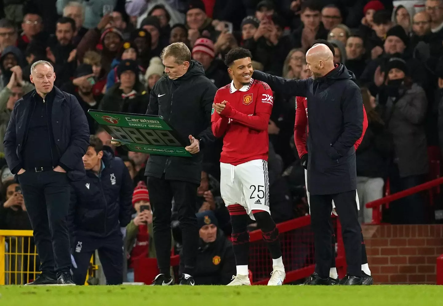 Sancho and Ten Hag on the touchline. (Image