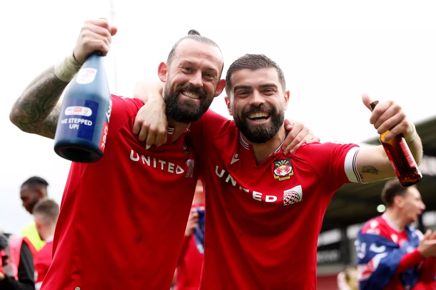 Steven Fletcher celebrates promotion from League Two with Wrexham team-mate Elliot Lee (