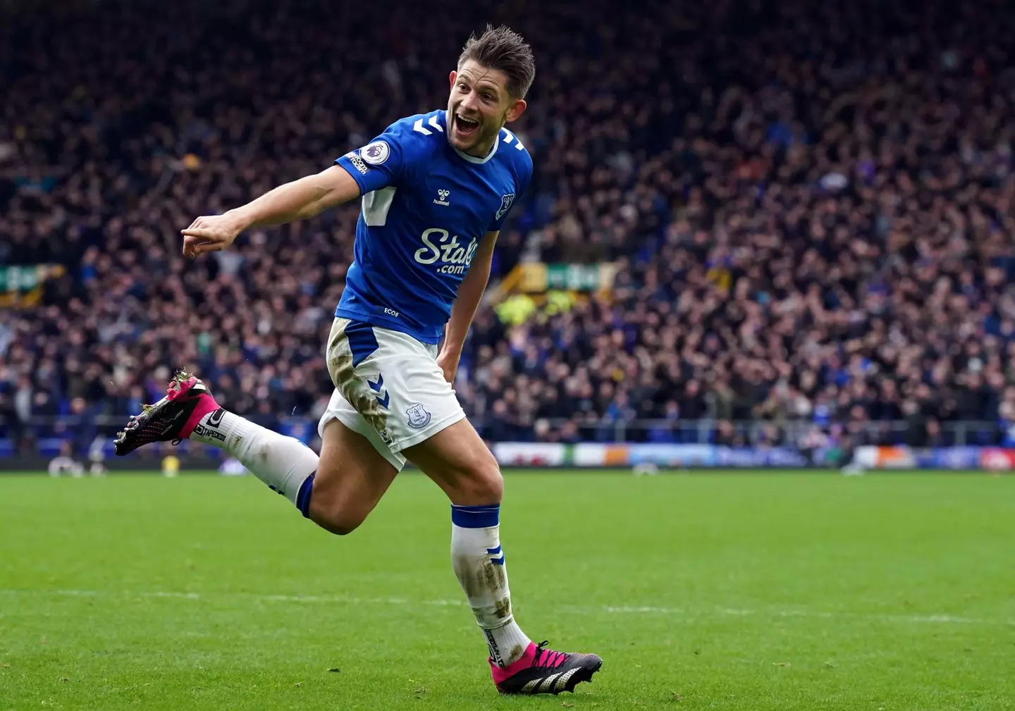 James Tarkowski wheels away in celebration after scoring against Arsenal. Image: Alamy