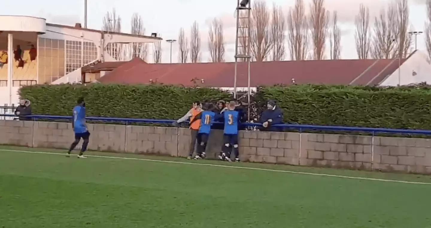 Part of the concrete block in place around the pitch at Wingate & Finchley's stadium (photo from 2020) (Image: Twitter/@WinFinchleyFC)