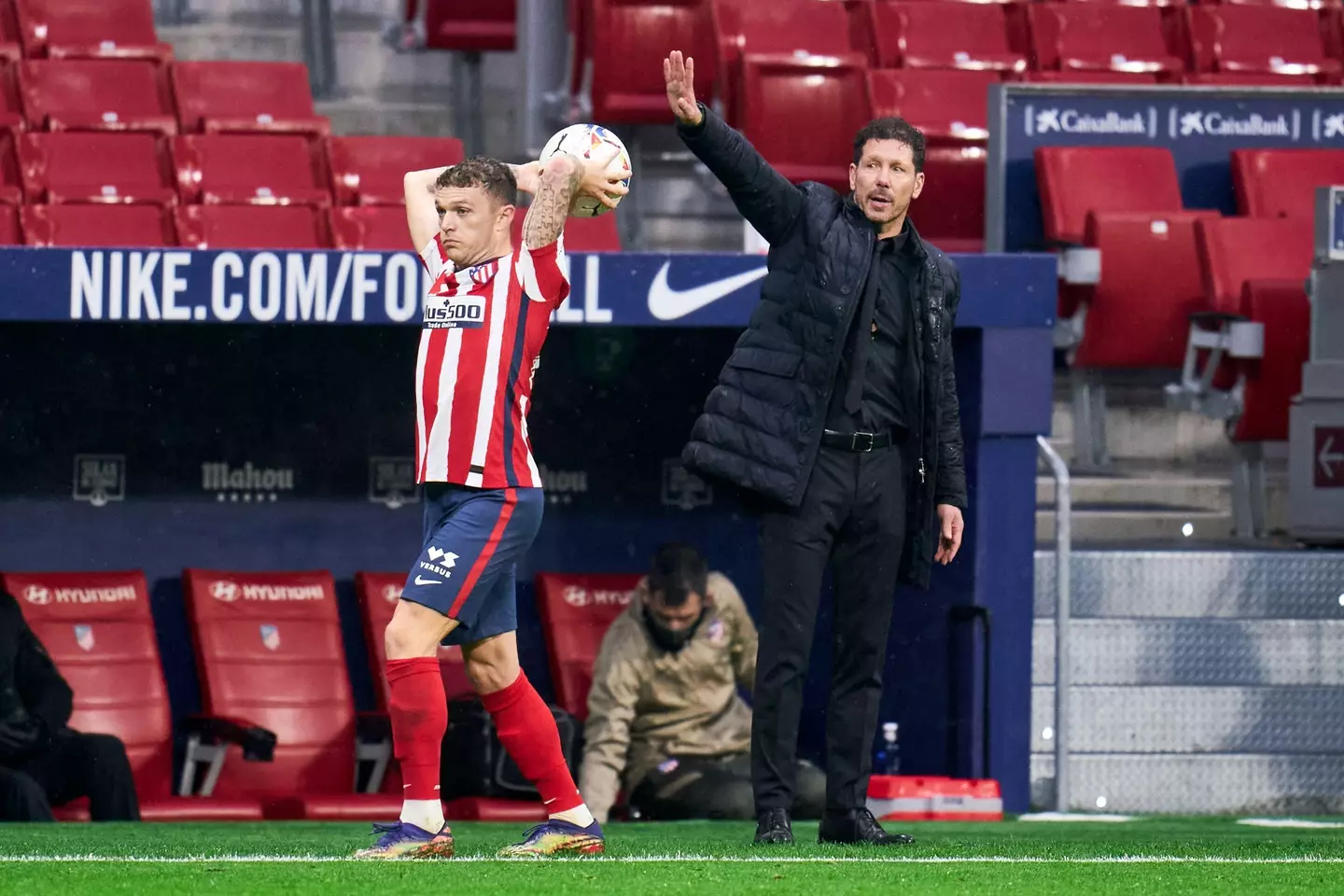 Simeone and Trippier during a game. (Image