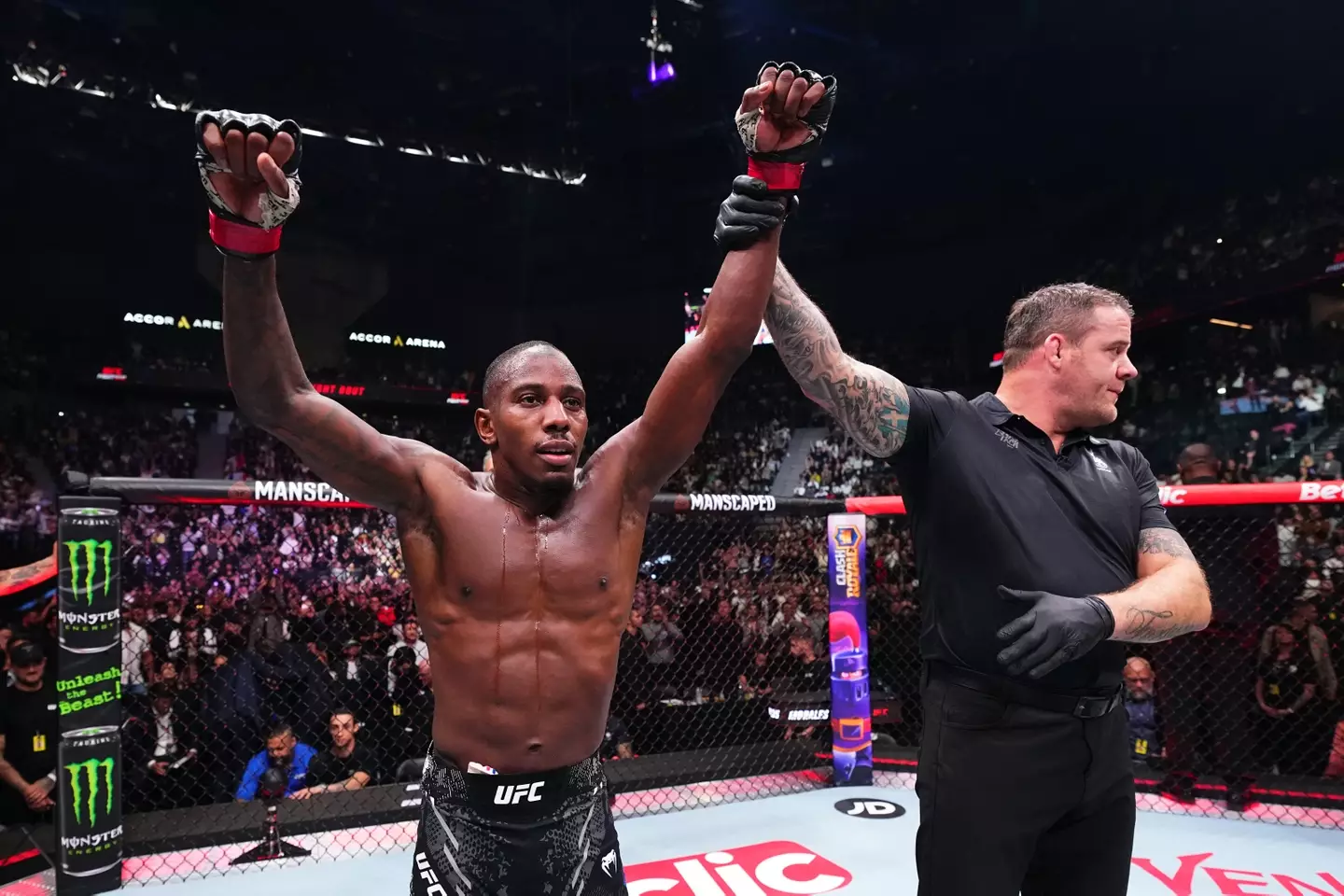 Taylor Lapilus gets his hand raised after beating Vince Morales. Image: Getty