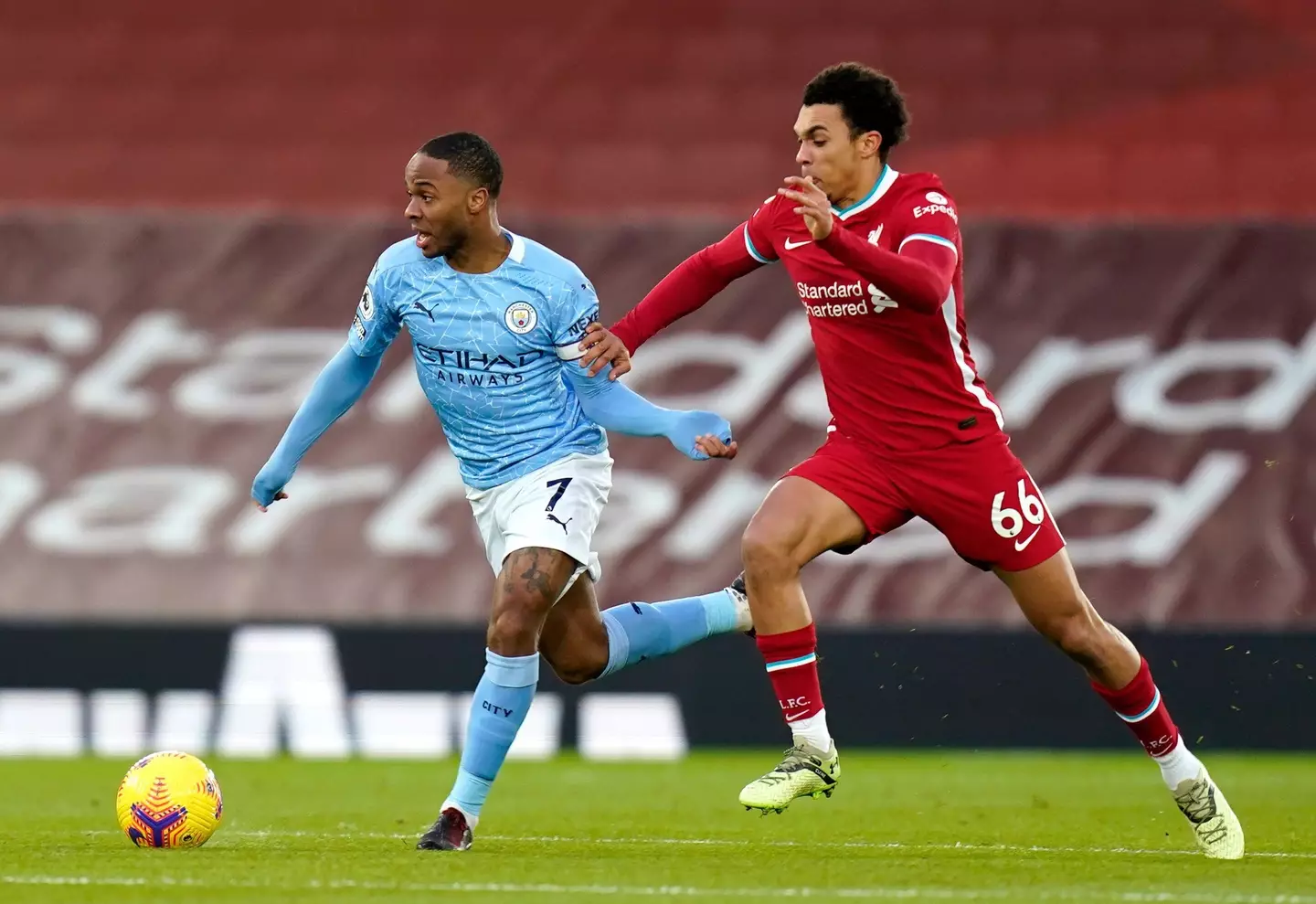 Manchester City's Raheem Sterling (left) and Liverpool's Trent Alexander-Arnold battle for the ball during the Premier League match at Anfield, Liverpool. (Alamy)