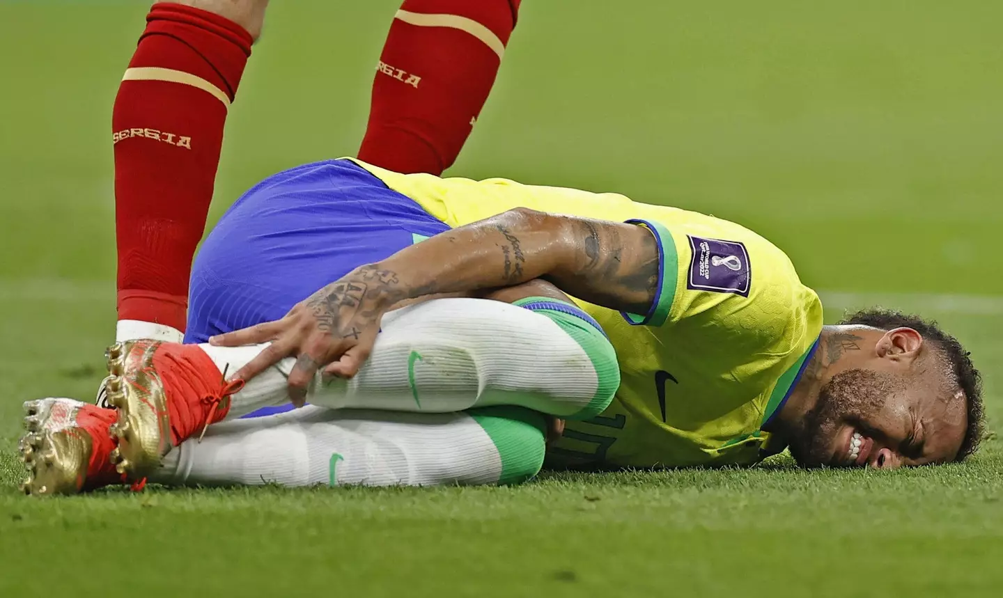 Neymar down injured against Serbia. (Image