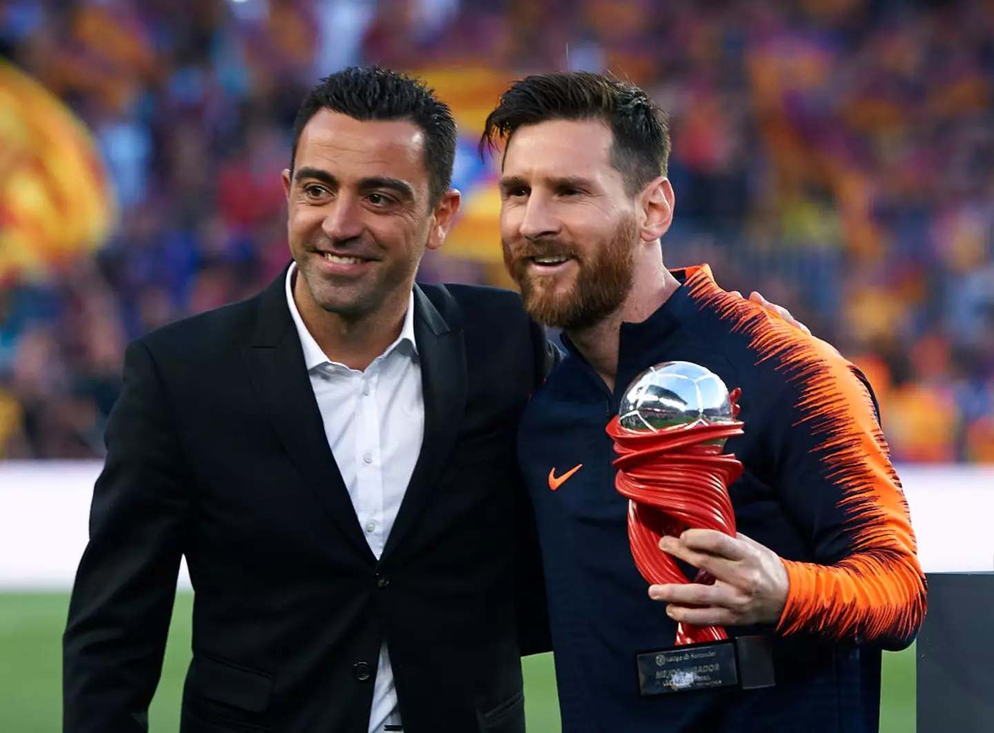 Messi with Xavi- Getty
