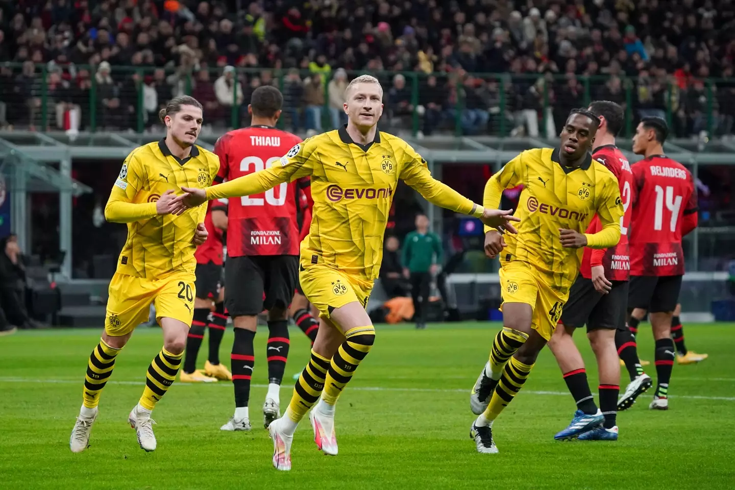 Marco Reus celebrates with his teammates after putting Dortmund ahead. (Image