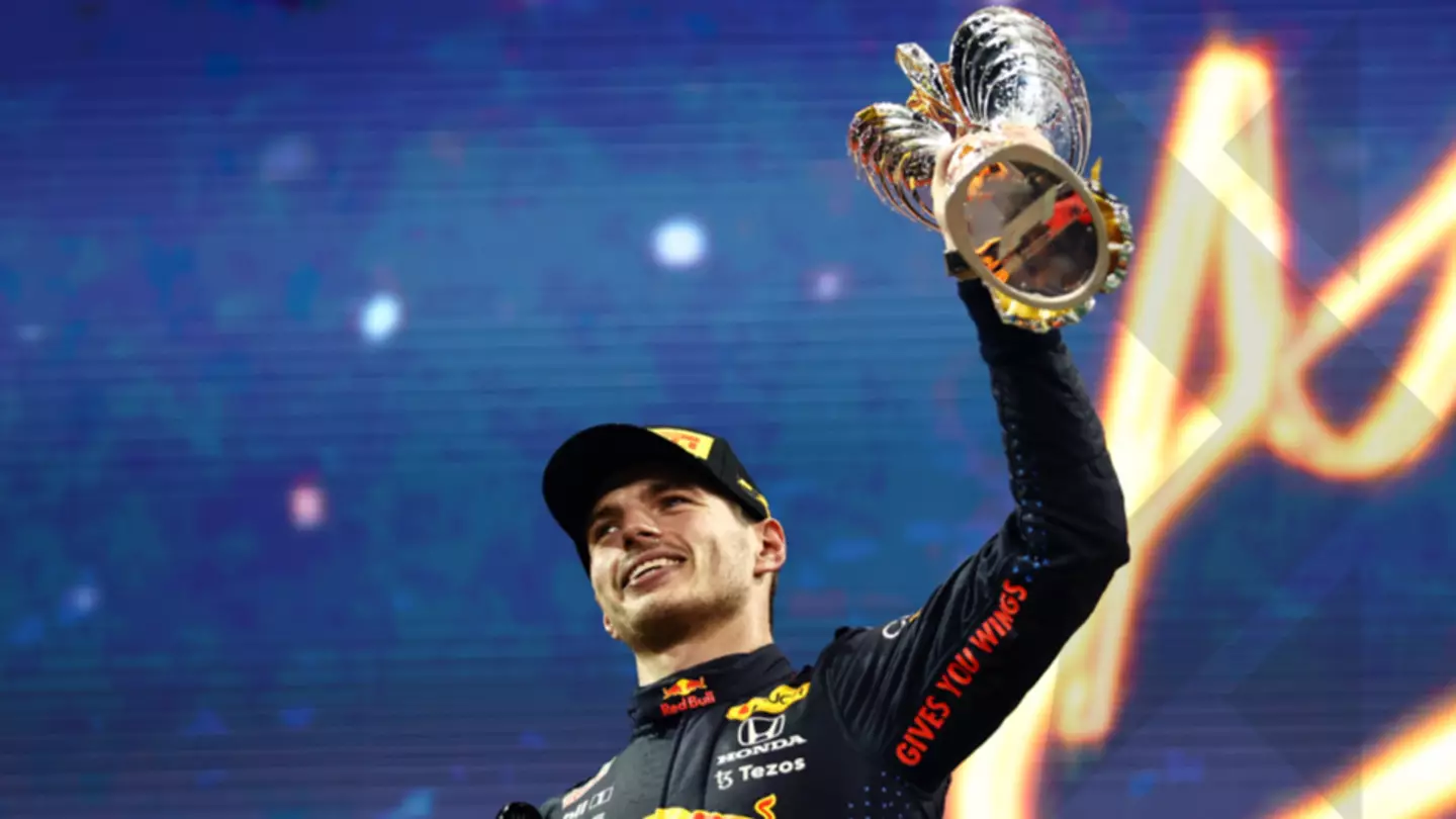 Verstappen with his world title trophy. Image: Alamy
