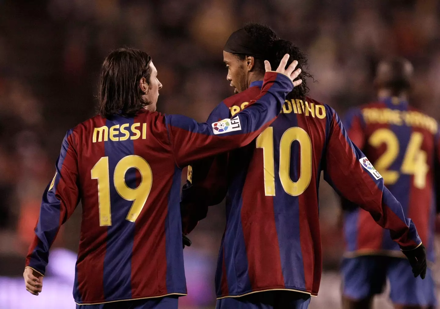 Lionel Messi and Ronaldinho during a Barcelona game. Image: Getty 