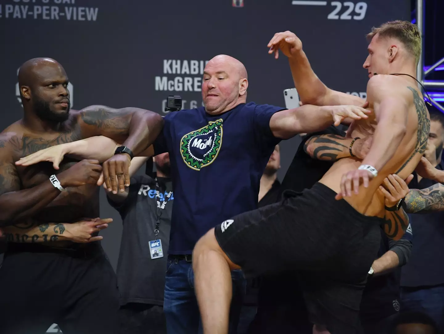 Dana White attempts to intervene a clash between Derrick Lewis and Alexander Volkov. Image: Getty