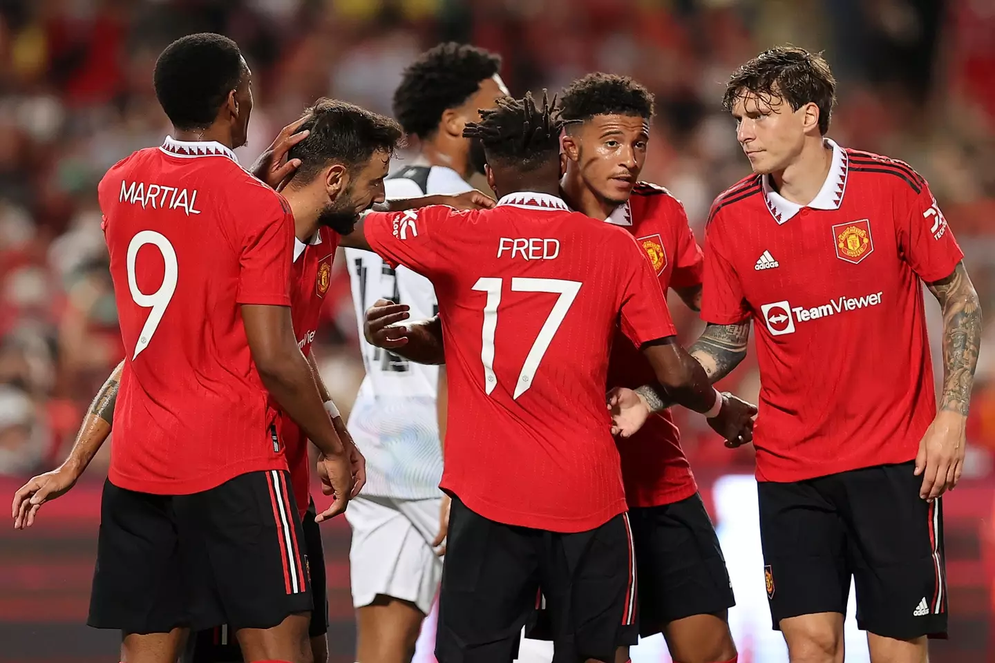The squad celebrates during the first half of an eventual victory over Liverpool. (Man Utd)