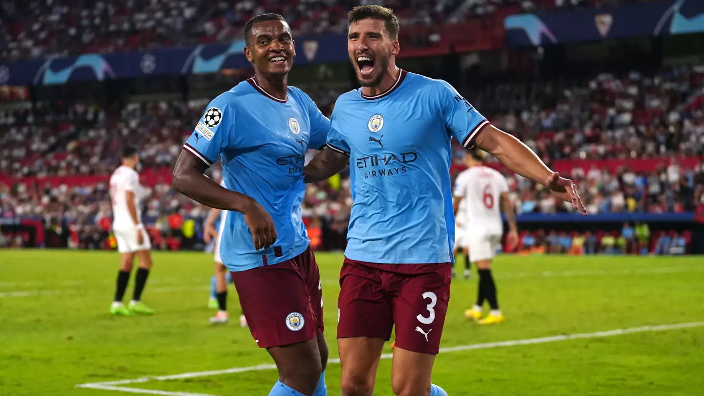 Ruben Dias celebrates with Manuel Akanji after scoring against Sevilla in the Champions League (PA Images/Alamy)