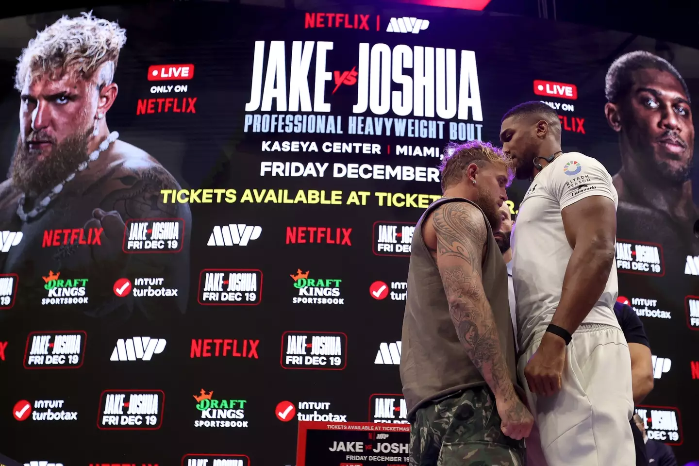 Jake Paul and Anthony Joshua face off at the launch presser. Image: Getty