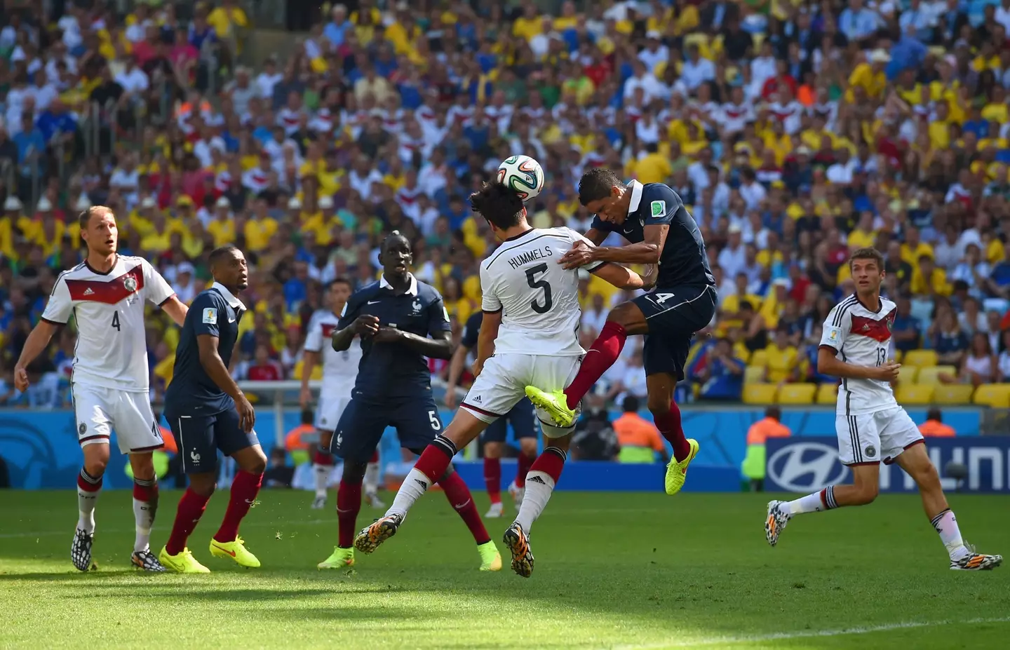Mats Hummels and Raphael Varane challenge for an aerial ball. Image: Getty