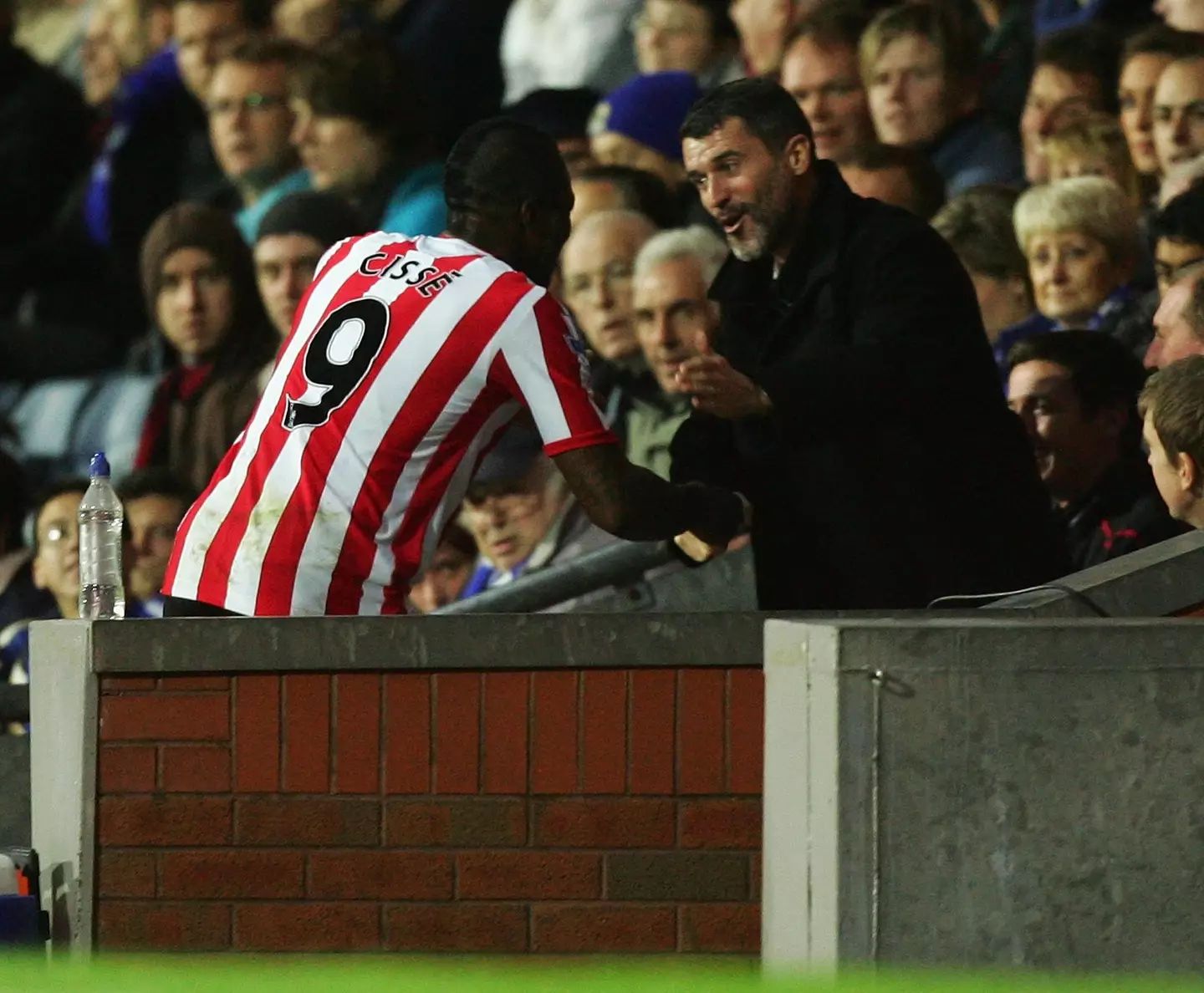 Djibril Cisse celebrates with Roy Keane. Image: Getty
