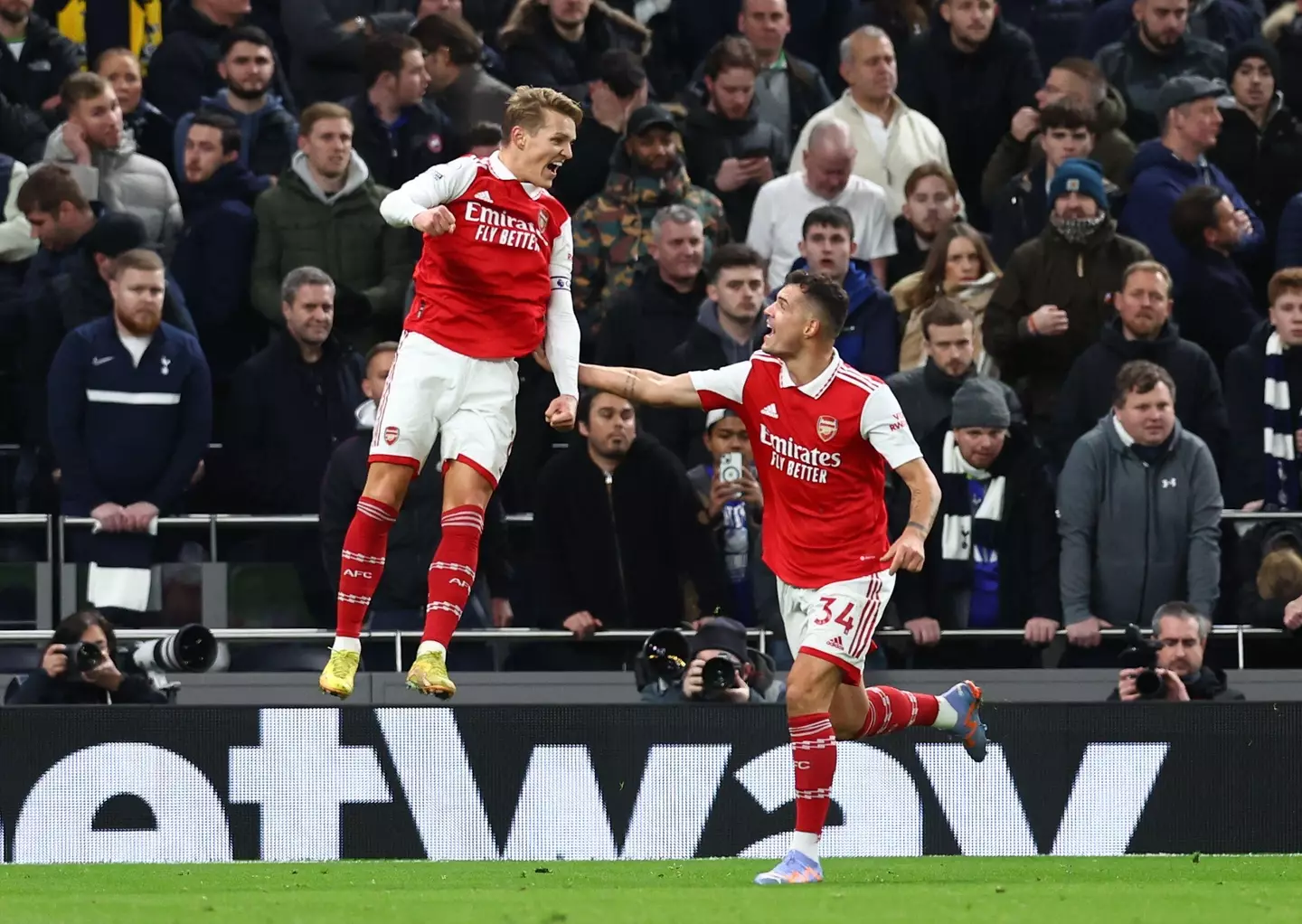 Odegaard celebrates his goal with Granit Xhaka. (Image