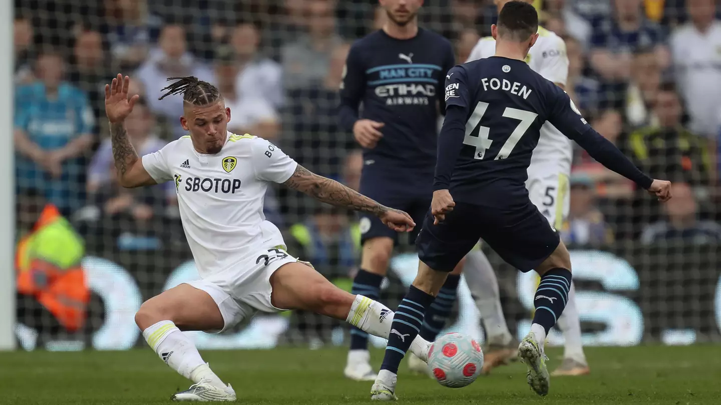 Kalvin Phillips tackles Manchester City's Phil Foden.