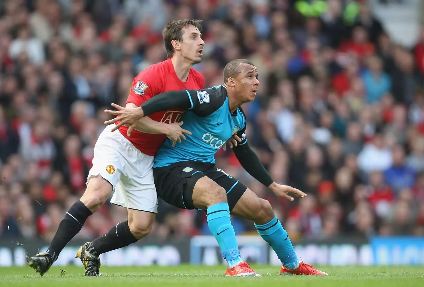 Gary Neville and Gabriel Agbonlahor duel for the ball. Image: Getty