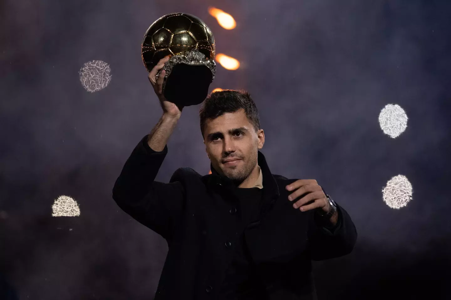 Rodri holds aloft the Ballon d'Or. Image: Getty