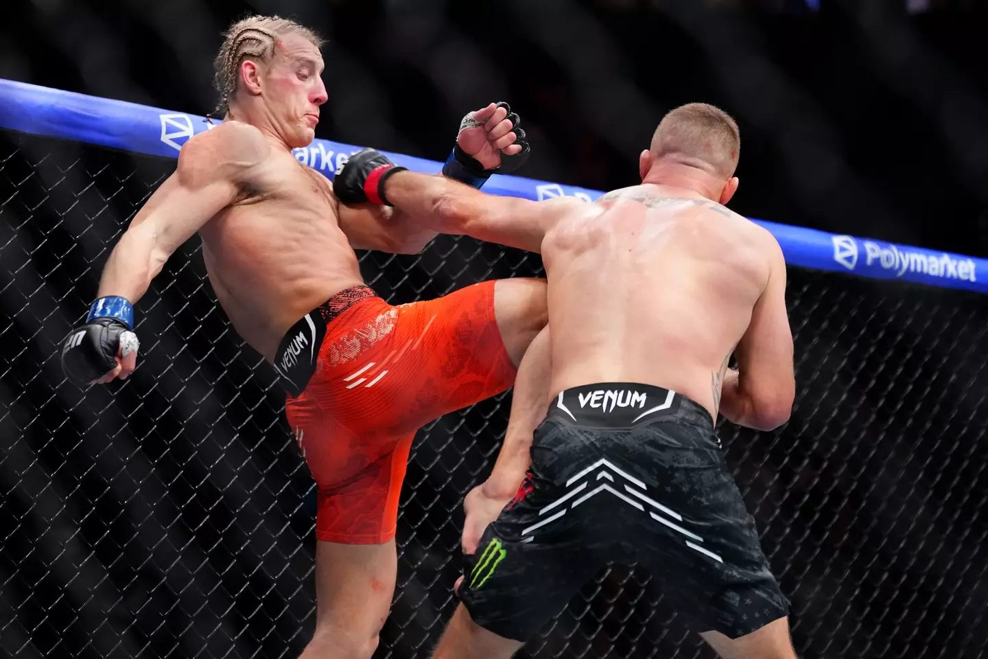 Paddy Pimblett and Justin Gaethje during their UFC 324 title fight. Image: Getty