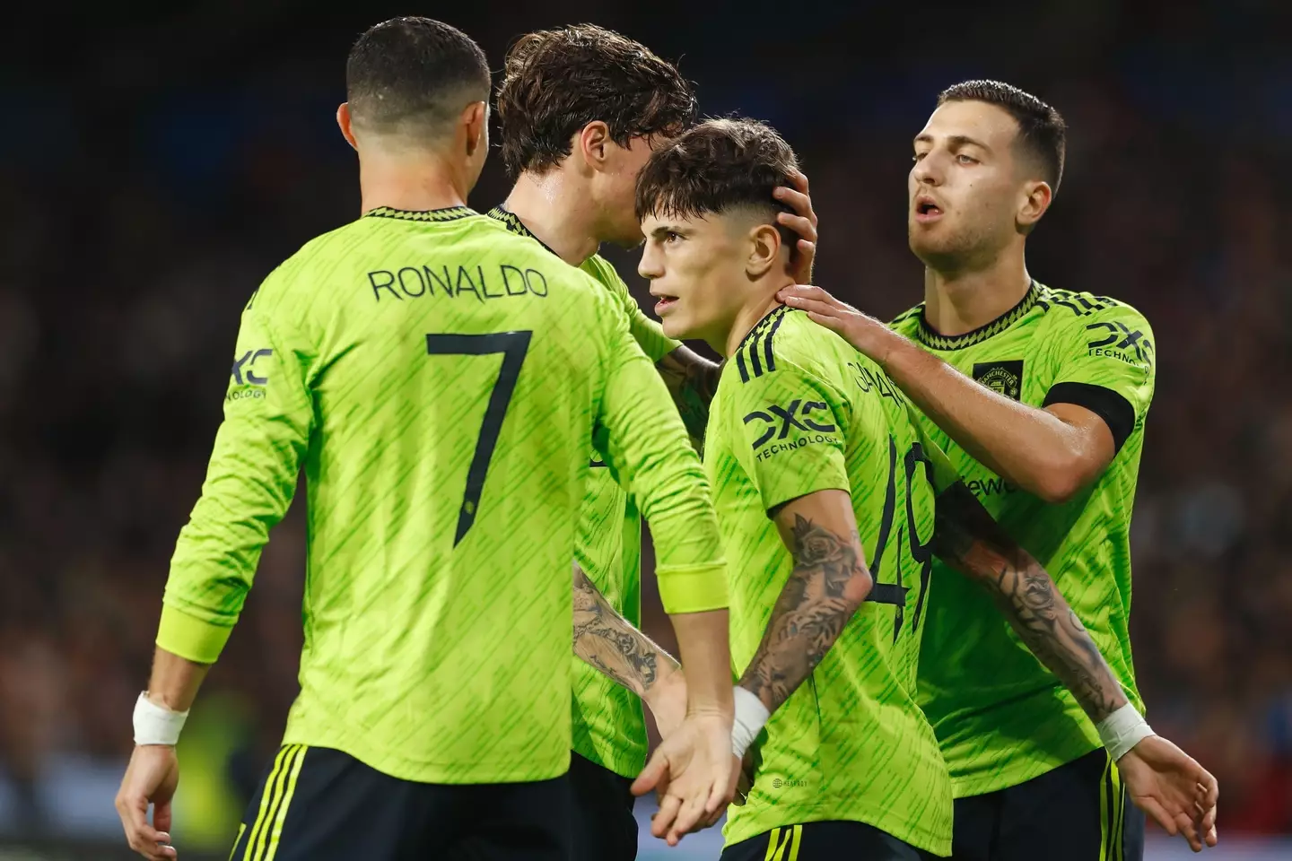 United players celebrate with Garnacho in the first half. (Image