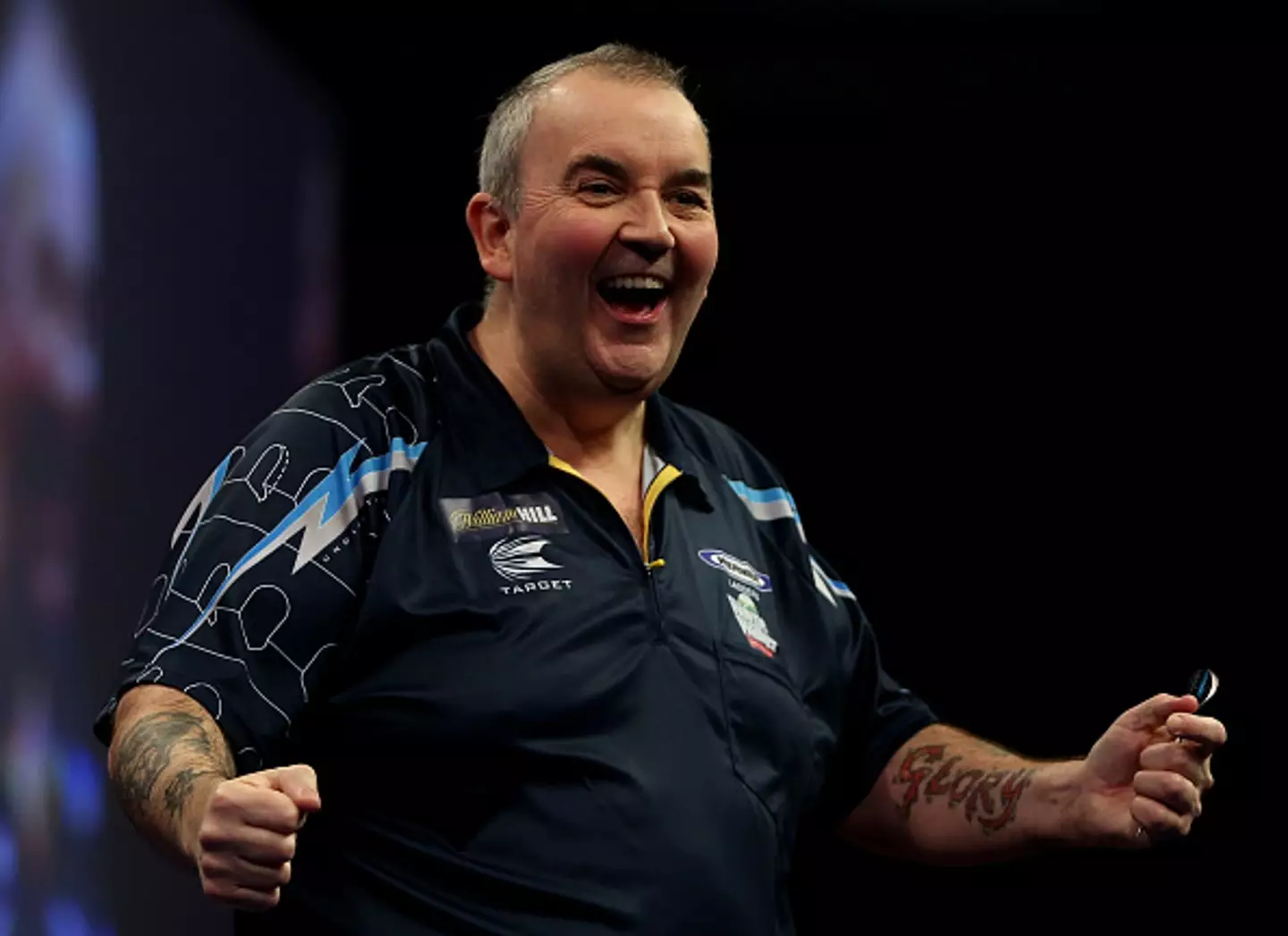 Phil Taylor has retired from darts but could be approached to compete in a Royal Rumble event (Image: Getty)