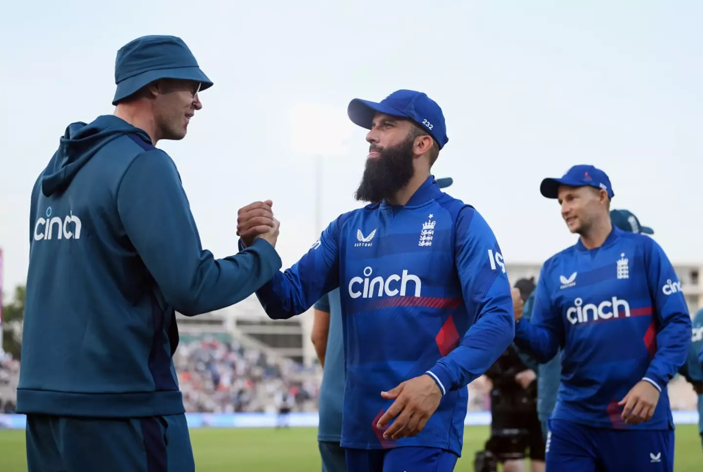 Andrew Flintoff shakes hands with England all-rounder Moeen Ali (