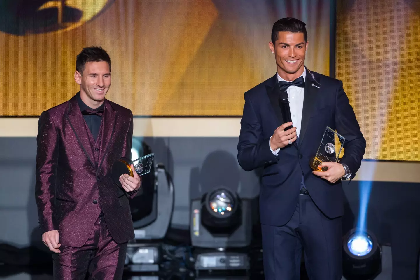 Cristiano Ronaldo and Lionel Messi during the 2014 Ballon d'Or ceremony. Image: Getty