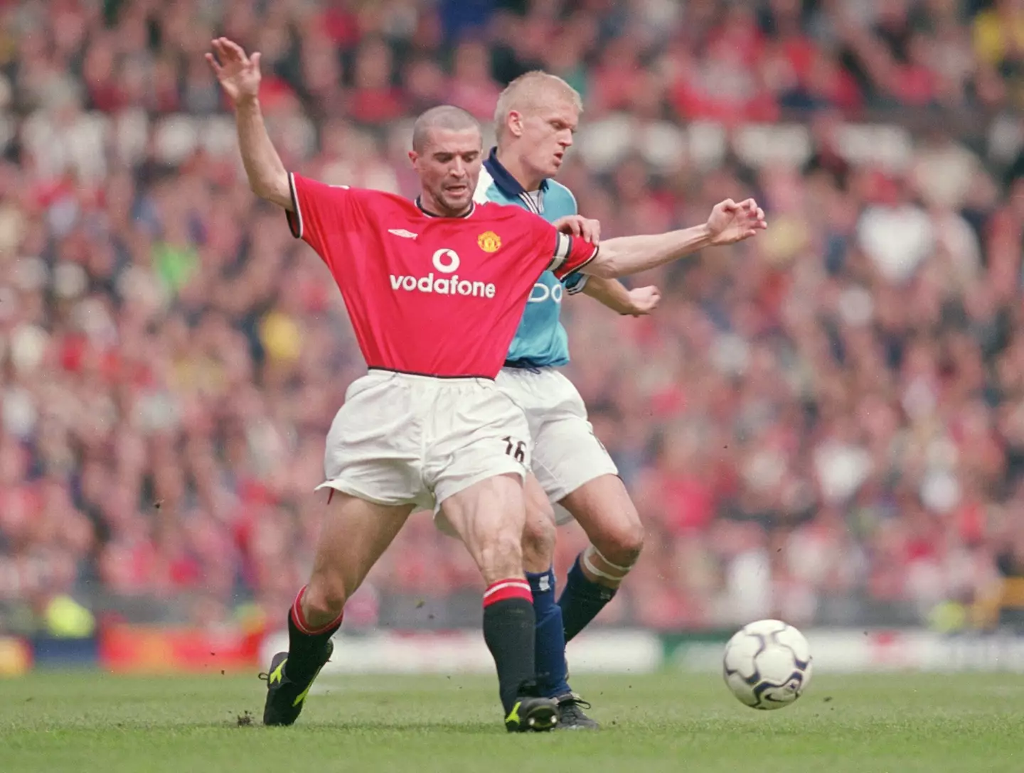 Roy Keane and Alfie Haaland battle for the ball