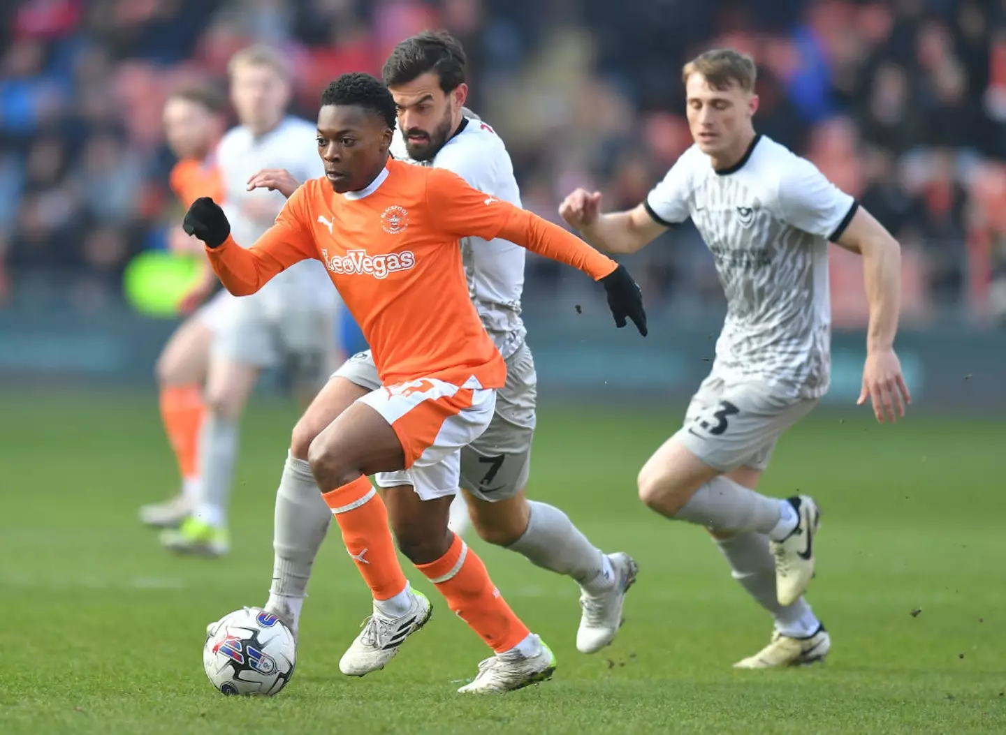 Karamoko Dembele in action for Blackpool against Portsmouth (