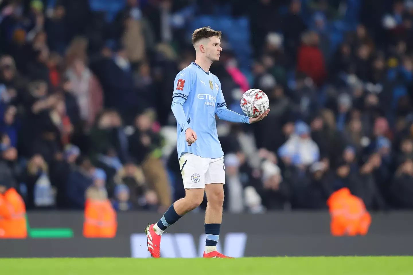 James McAtee takes home the match ball after his hat-trick against Salford City. Image: Getty
