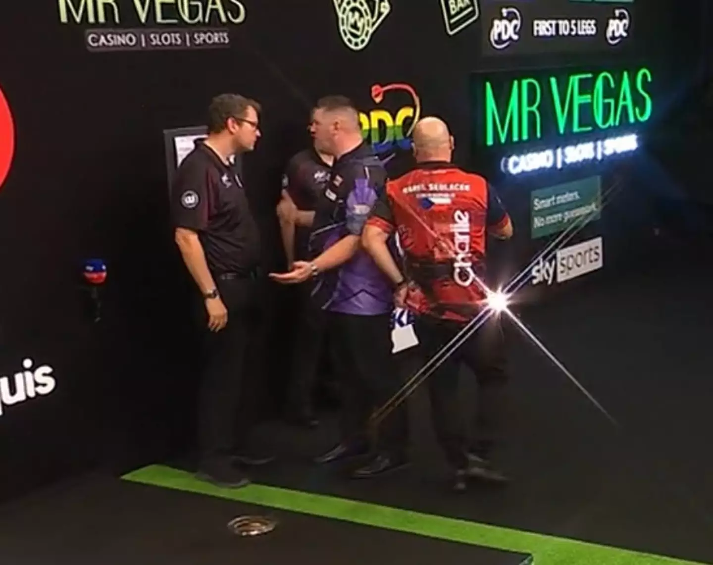 Gurney speaks to Kirk Bevins after his Grand Slam defeat to Karel Sedlacek. Image credit: PDC