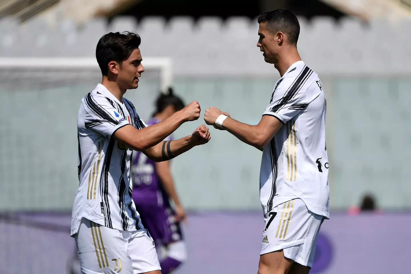 Paulo Dybala and Cristiano Ronaldo embrace during a league match for Juventus. Image: Getty