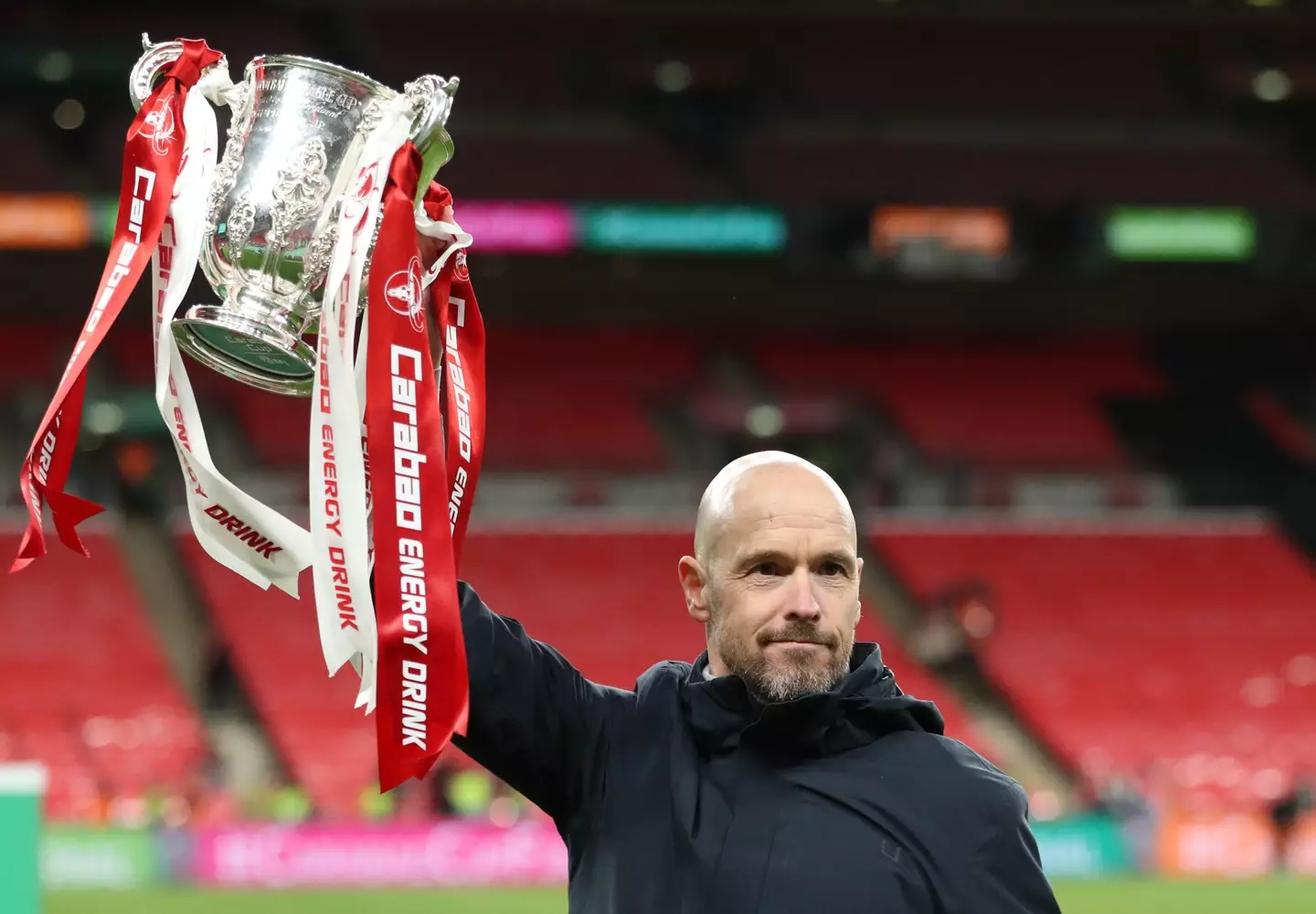 Erik ten Hag celebrates with the Carabao Cup trophy. Image: Alamy 