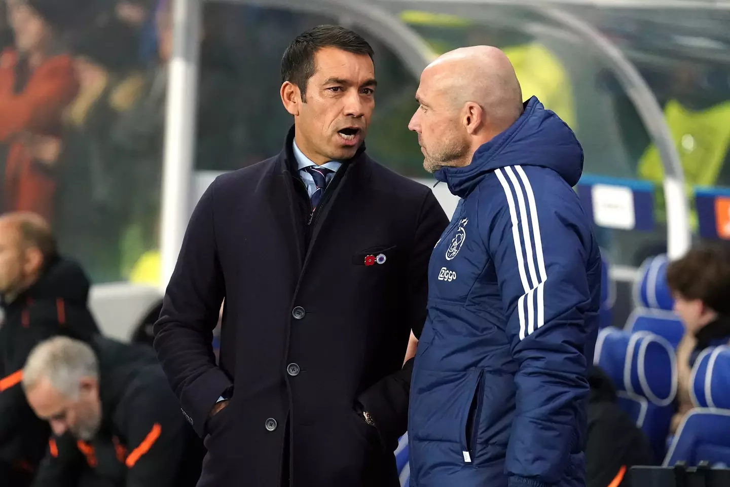 Van Bronckhorst in conversation with Ajax head coach Alfred Schreuder. (Image