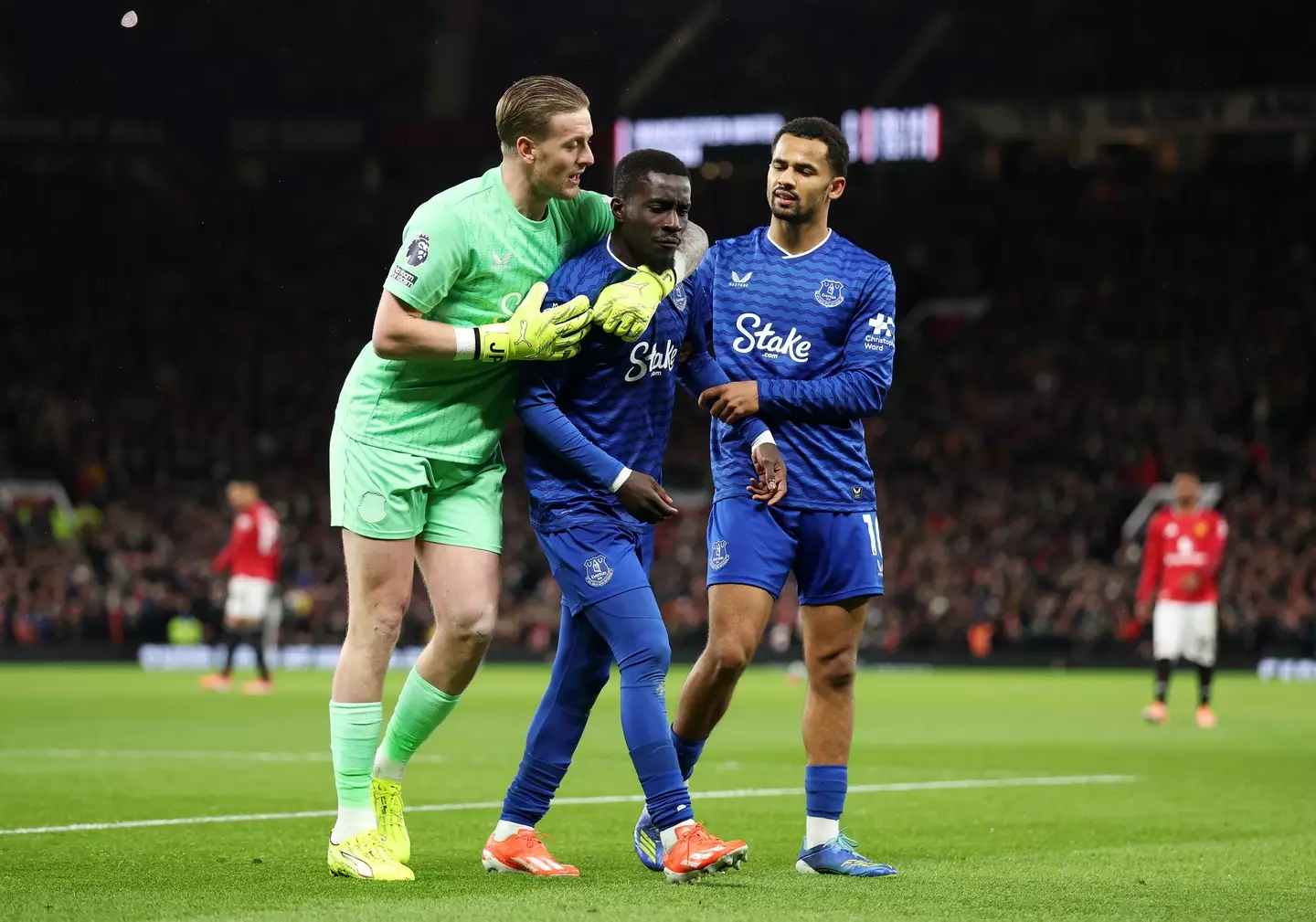 Jordan Pickford and Iliman Ndiaye holding back idrissa Gueye after his red card at Old Trafford (credit: getty)