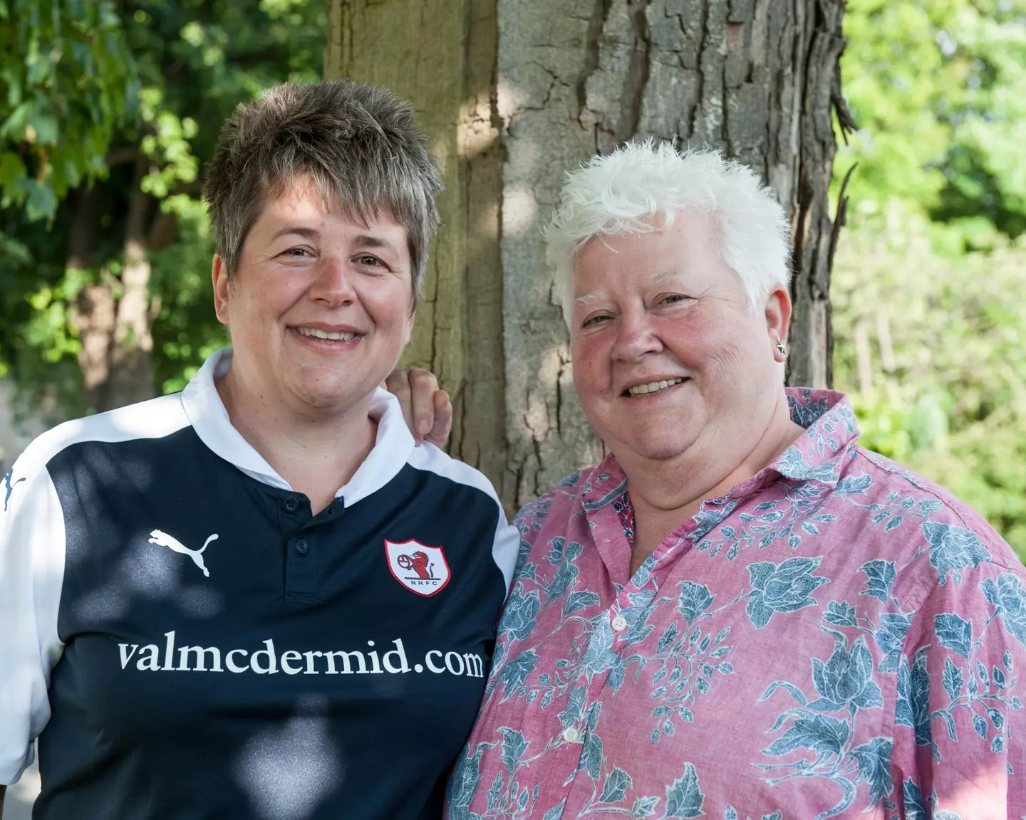 McDermid, right, with her partner wearing the Raith Rovers shirt adorning the writer's sponsorship. Image: PA Images