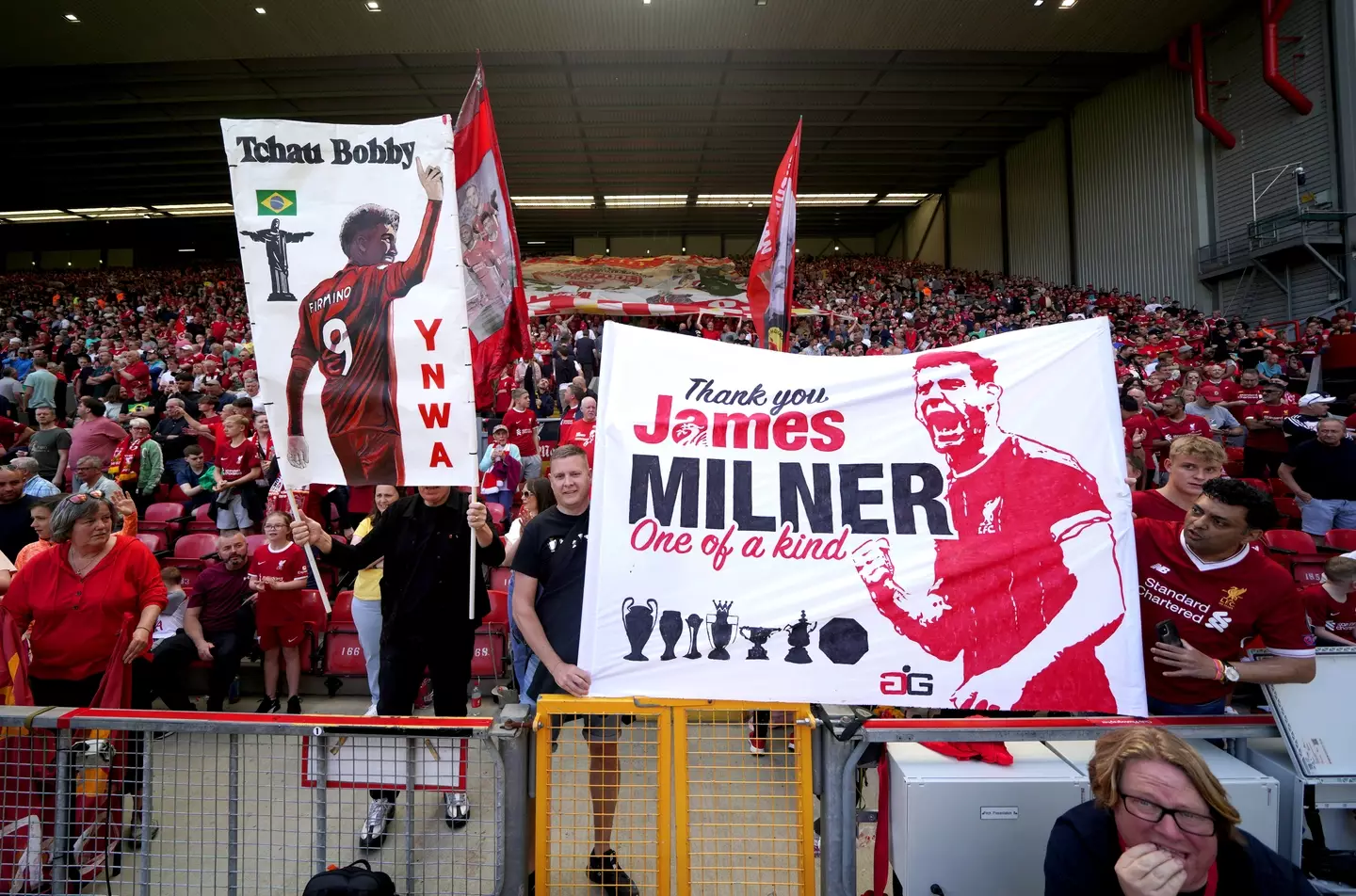 Fnas held up banners for James Milner and Roberto Firmino in the final home game of the season, with both set to leave this summer. (