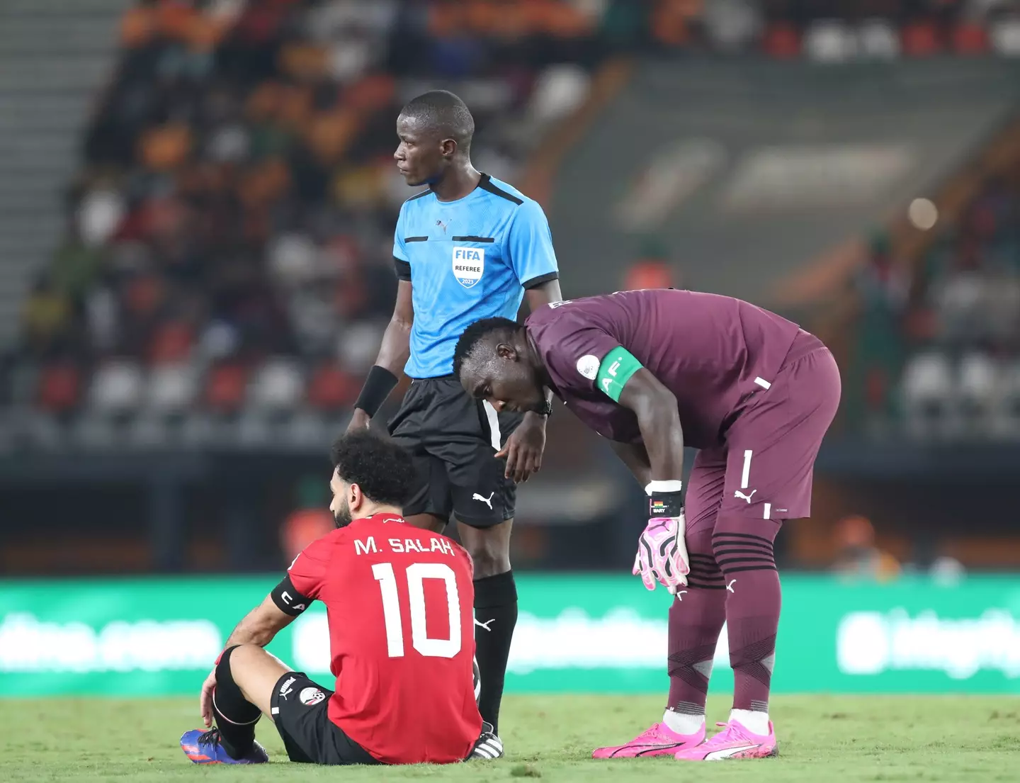 Mohamed Salah sits on the floor with an injury. Image: Getty 