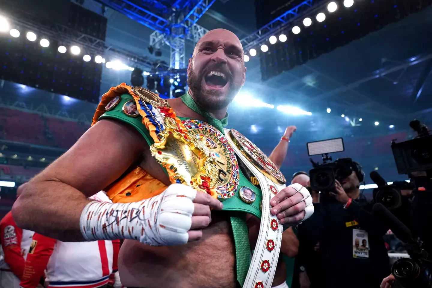 Fury with his world title belts. Image