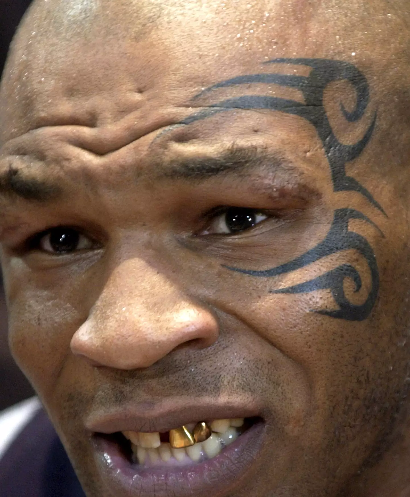 Mike Tyson sported a new tattoo on the left side of his face ahead of his bout with Clifford Etienne. Image credit: Getty