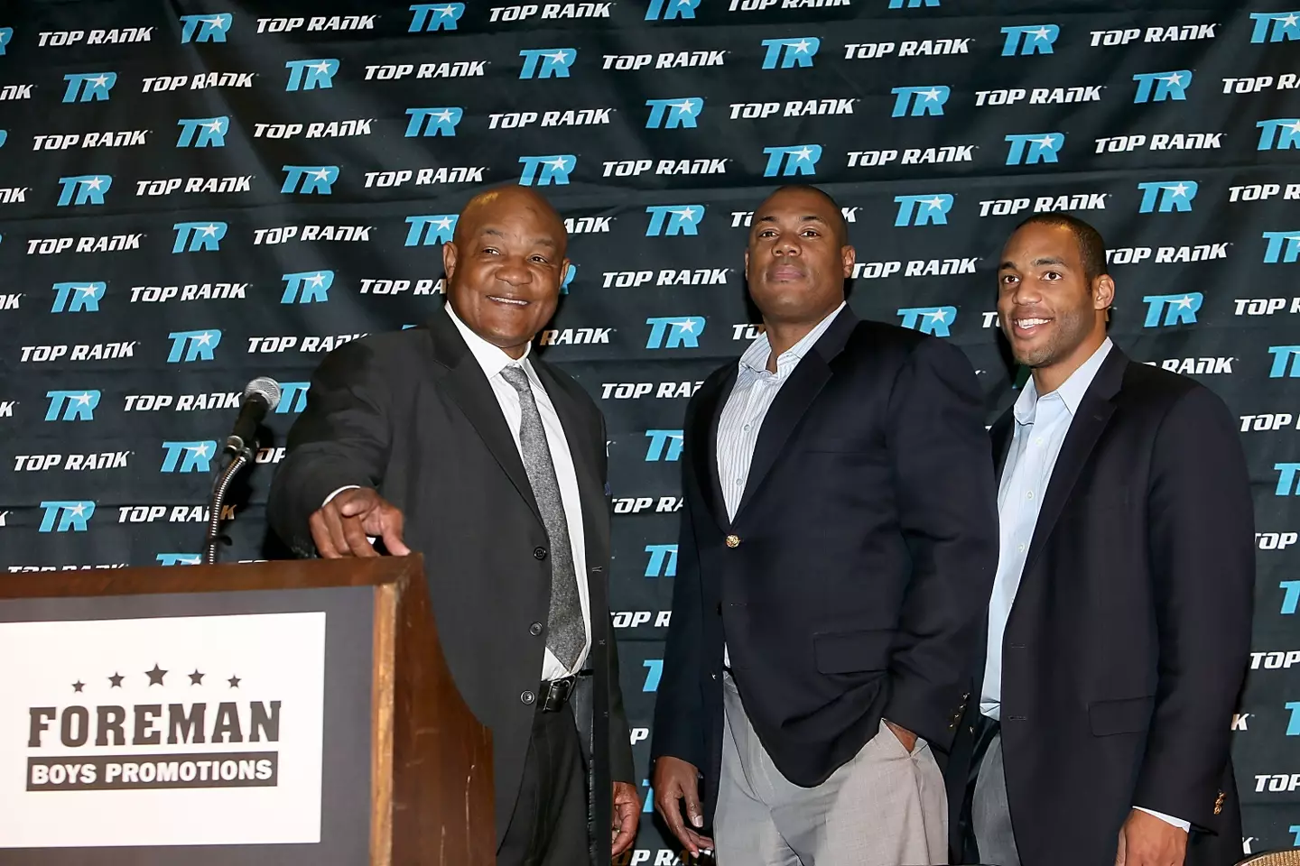 George Foreman and two of his sons with the same name. Image: Getty