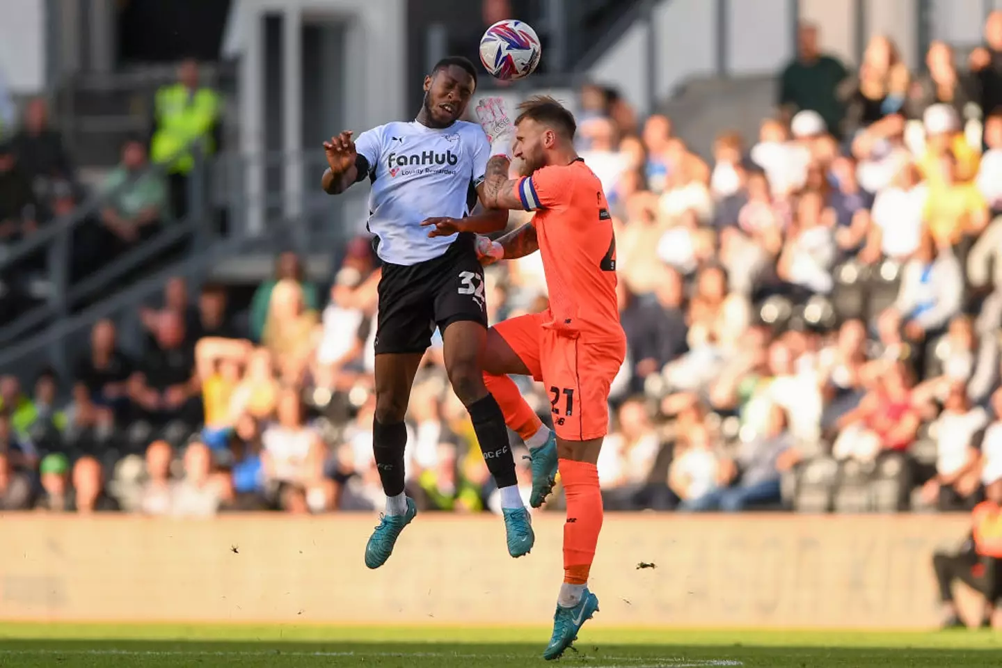 Derby's Ebou Adams challenges for the ball with Cardiff goalkeeper Jak Alnwick -